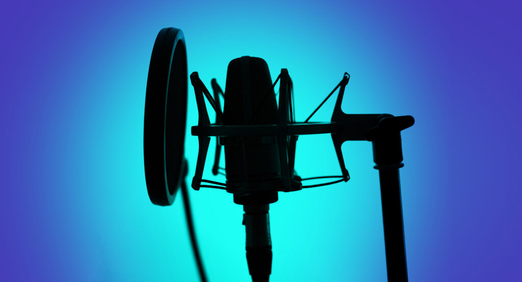 Photograph of microphone in recording studio.
